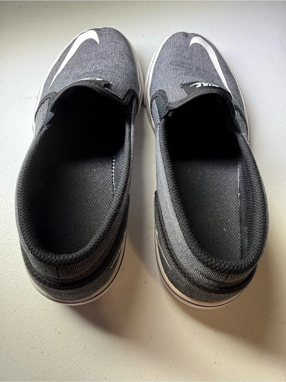 Nike Toki Men’s 7.5/Women’s 8.5 Black Canvas Slip-On Sneakers with White Swoosh